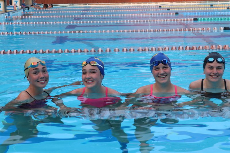 Smiling Rebels swimmers in the pool